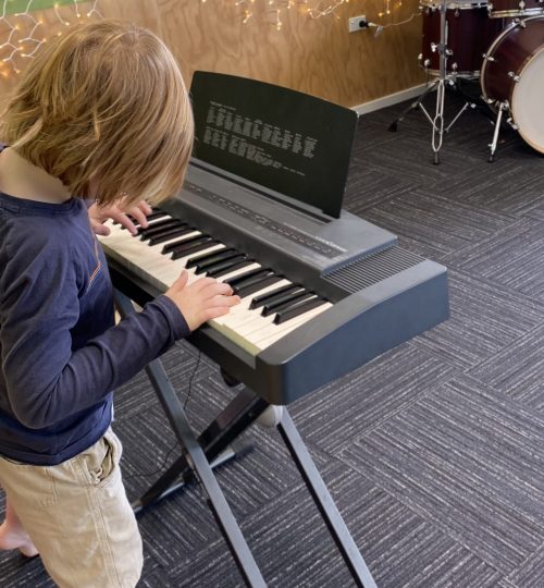 Child playing keyboard