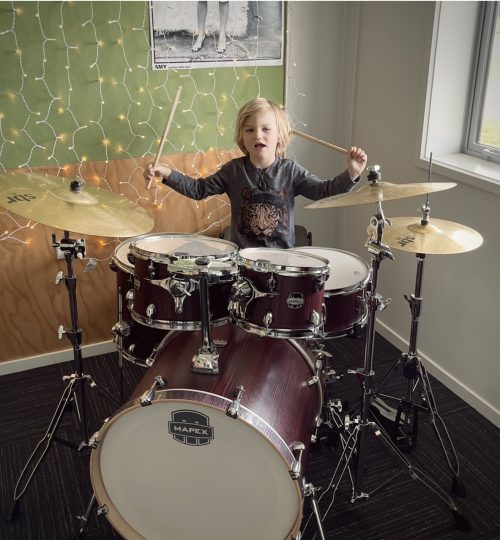 Child playing drums